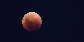A total lunar eclipse dubbed the 'blood' moon is pictured in Santiago, Chile, May 15, 2022. Picture taken May 15, 2022. REUTERS/Pablo Sanhueza